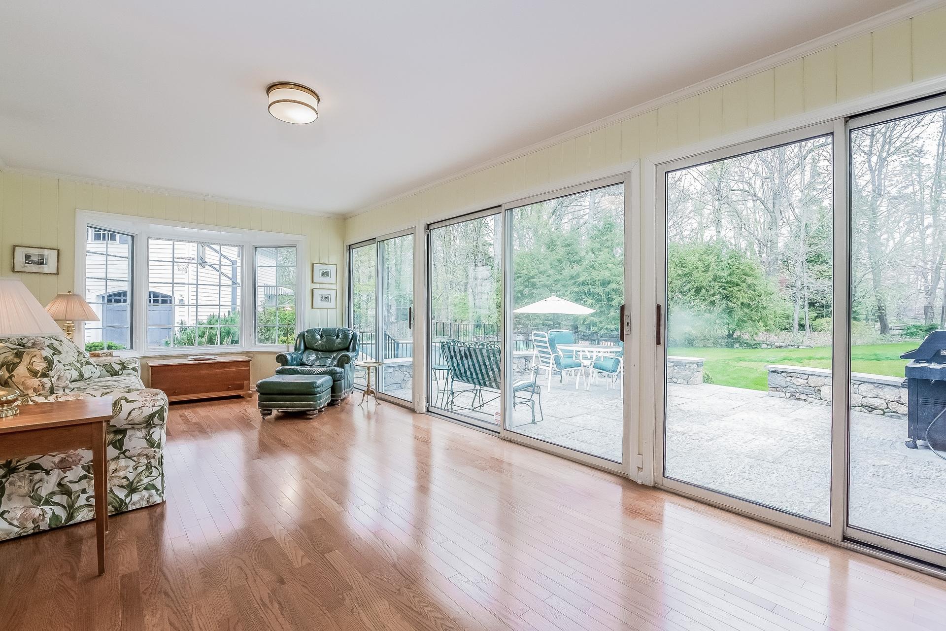 11 Pondfield Lane Darien, CT 06820 - Photo 21 of 31 a living room with furniture and a large window