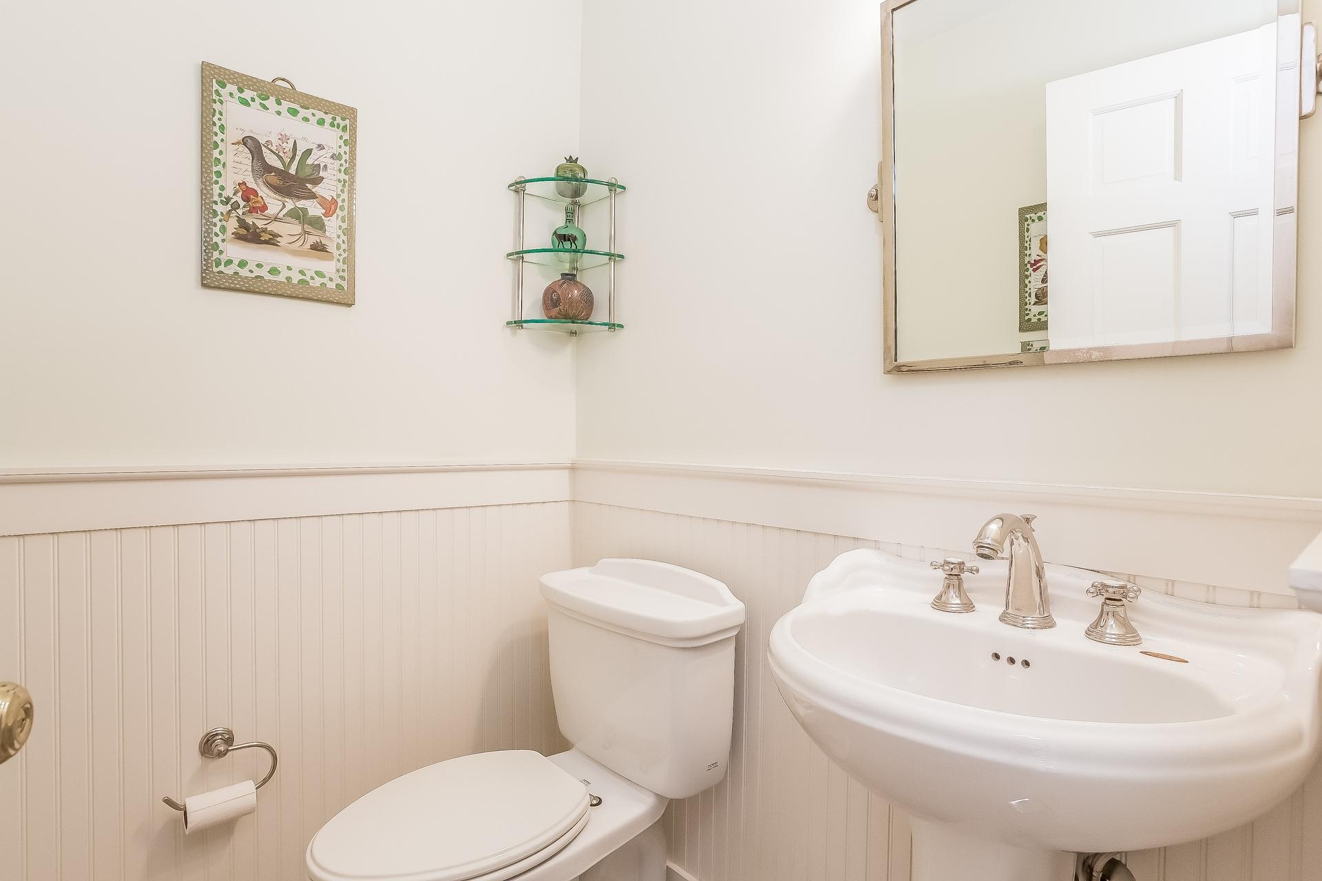 11 Pondfield Lane Darien, CT 06820 - Photo 22 of 31 a bathroom with a toilet sink and mirror