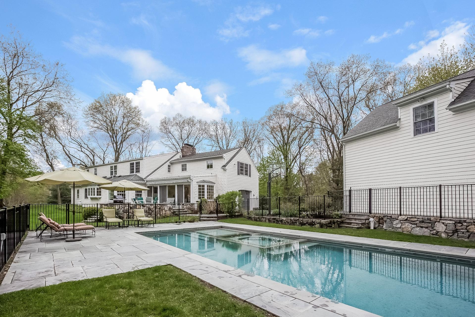 11 Pondfield Lane Darien, CT 06820 - Photo 24 of 31 a house view with swimming pool and sitting space