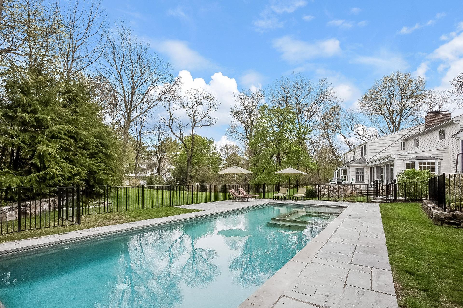 11 Pondfield Lane Darien, CT 06820 - Photo 25 of 31 a view of a patio with a yard
