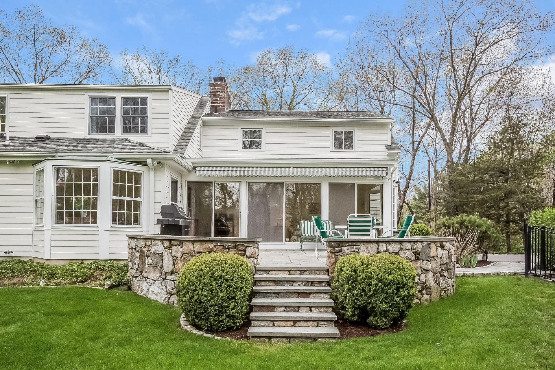 11 Pondfield Lane Darien, CT 06820 - Photo 27 of 31 a front view of a house with garden and yard