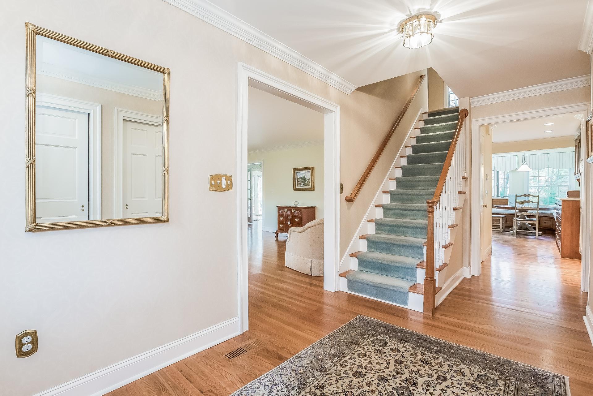 11 Pondfield Lane Darien, CT 06820 - Photo 3 of 31 a view of entryway and hall with wooden floor