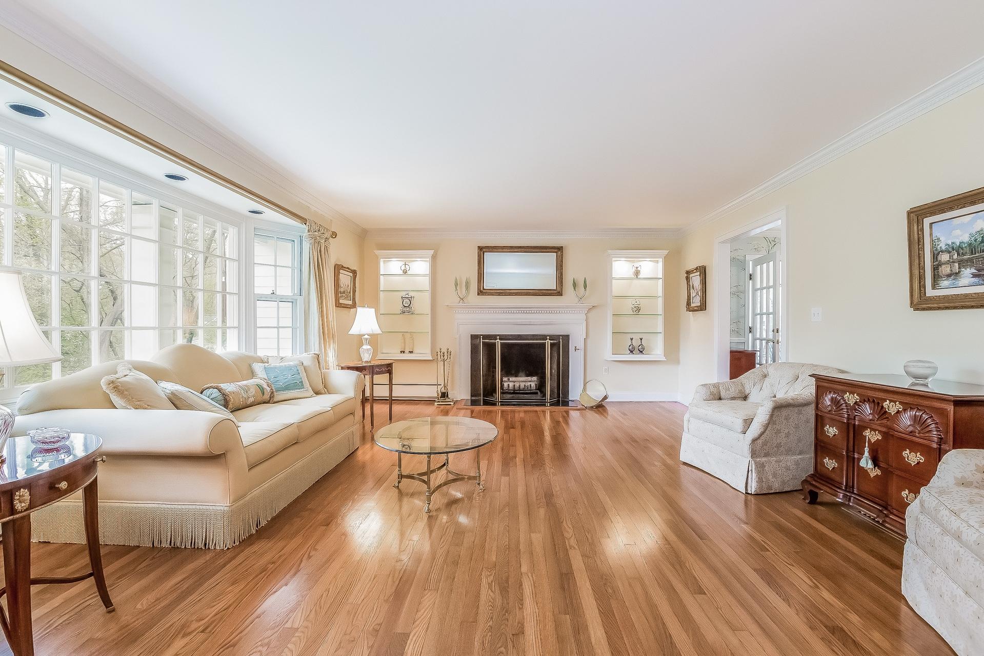 11 Pondfield Lane Darien, CT 06820 - Photo 4 of 31 a living room with furniture and a fireplace