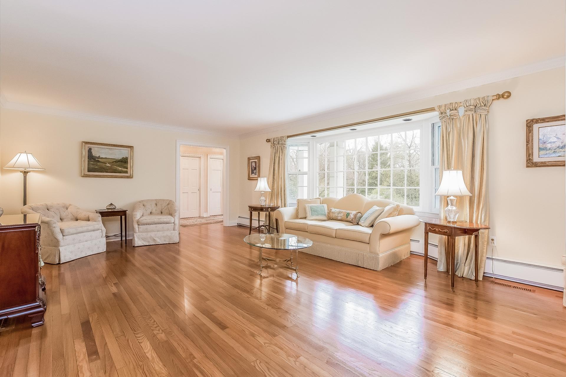 11 Pondfield Lane Darien, CT 06820 - Photo 5 of 31 a living room with furniture and a wooden floor