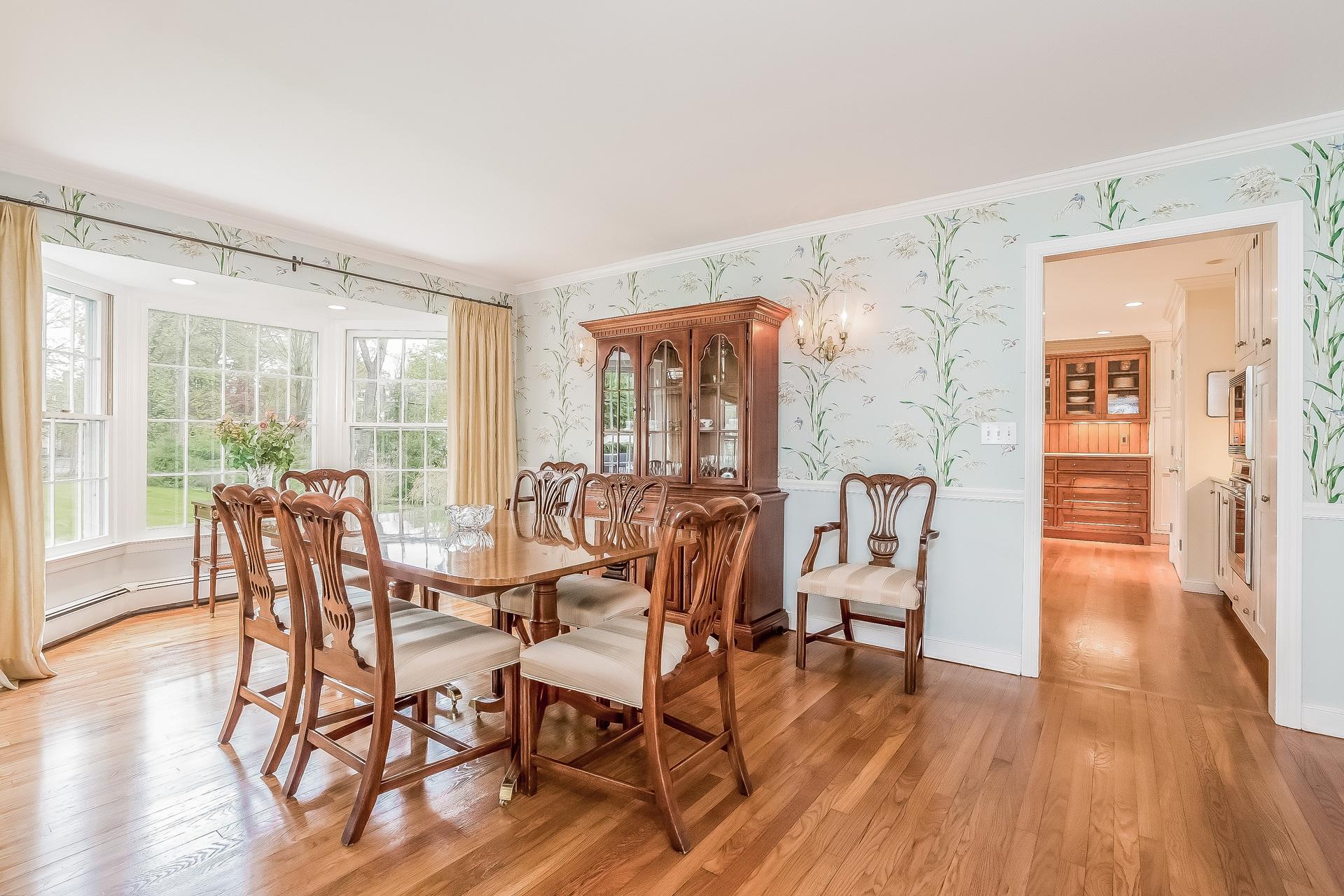 11 Pondfield Lane Darien, CT 06820 - Photo 6 of 31 a view of a dining room with furniture and wooden floor