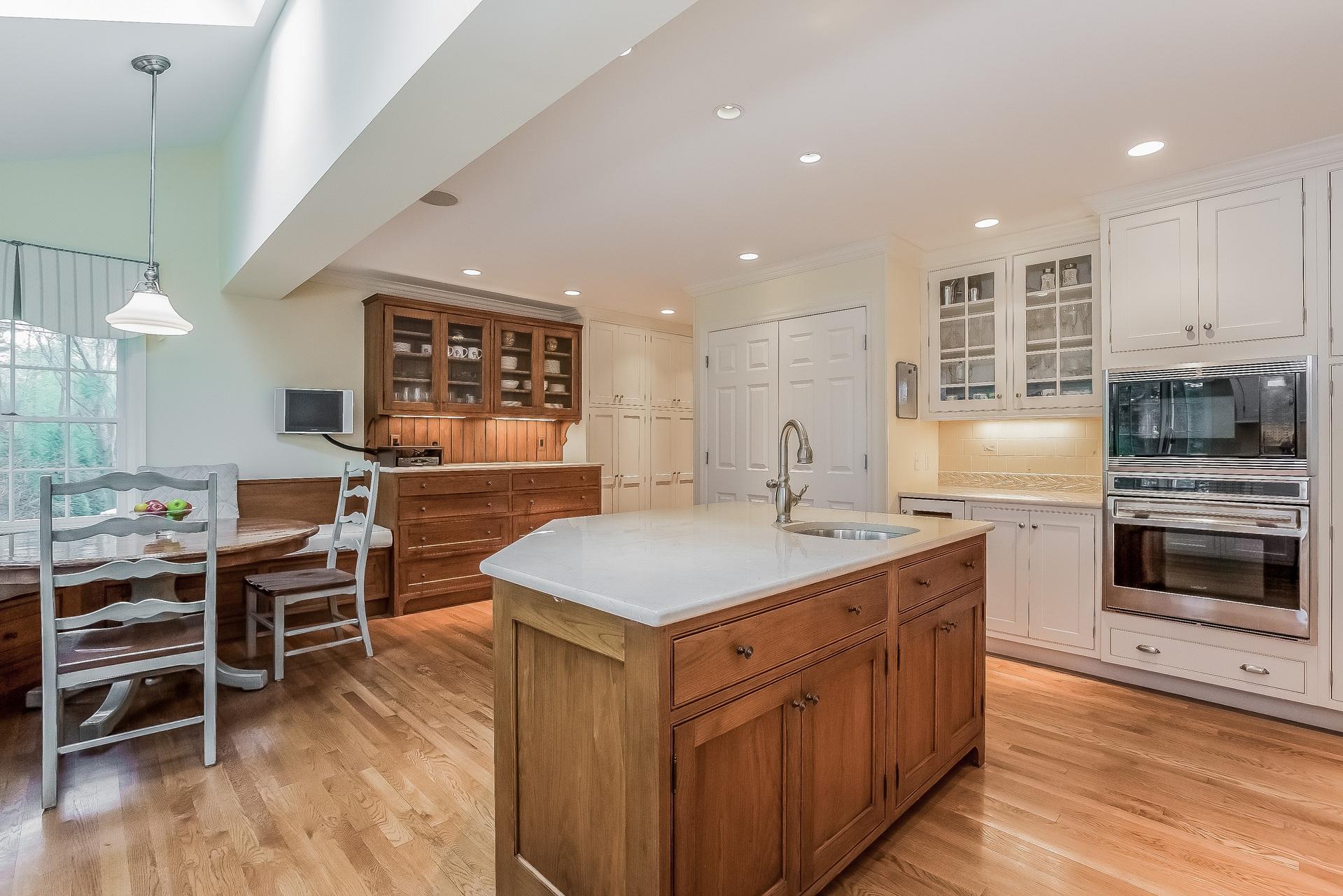 11 Pondfield Lane Darien, CT 06820 - Photo 7 of 31 a kitchen with a stove a counter top space and cabinets