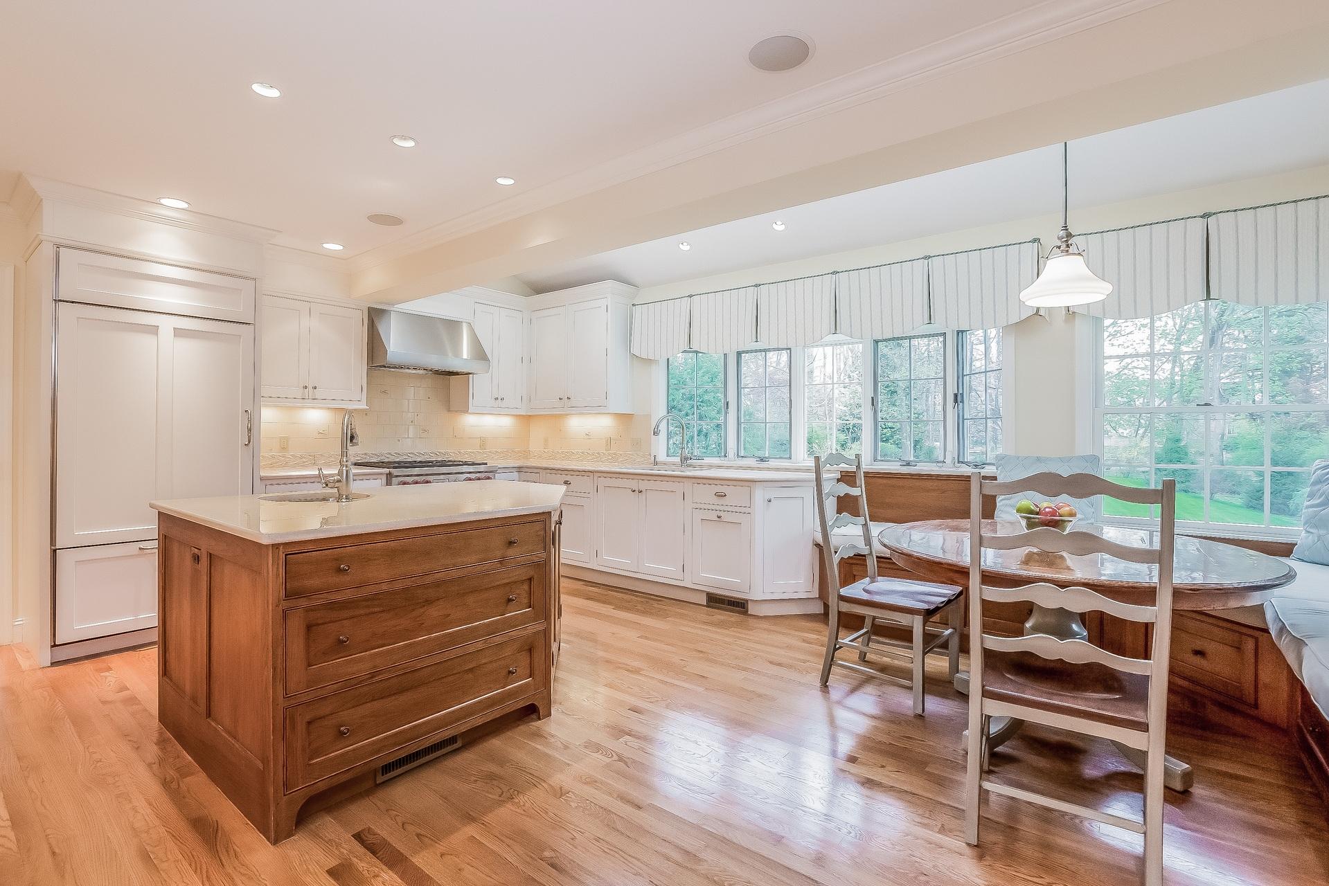 11 Pondfield Lane Darien, CT 06820 - Photo 8 of 31 a kitchen with stainless steel appliances kitchen island granite countertop a table chairs and a view of living room