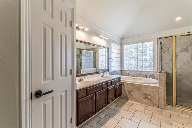 a bathroom with a granite countertop sink a toilet and bathtub