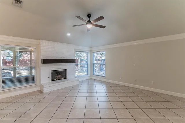 a view of an empty room with a fireplace
