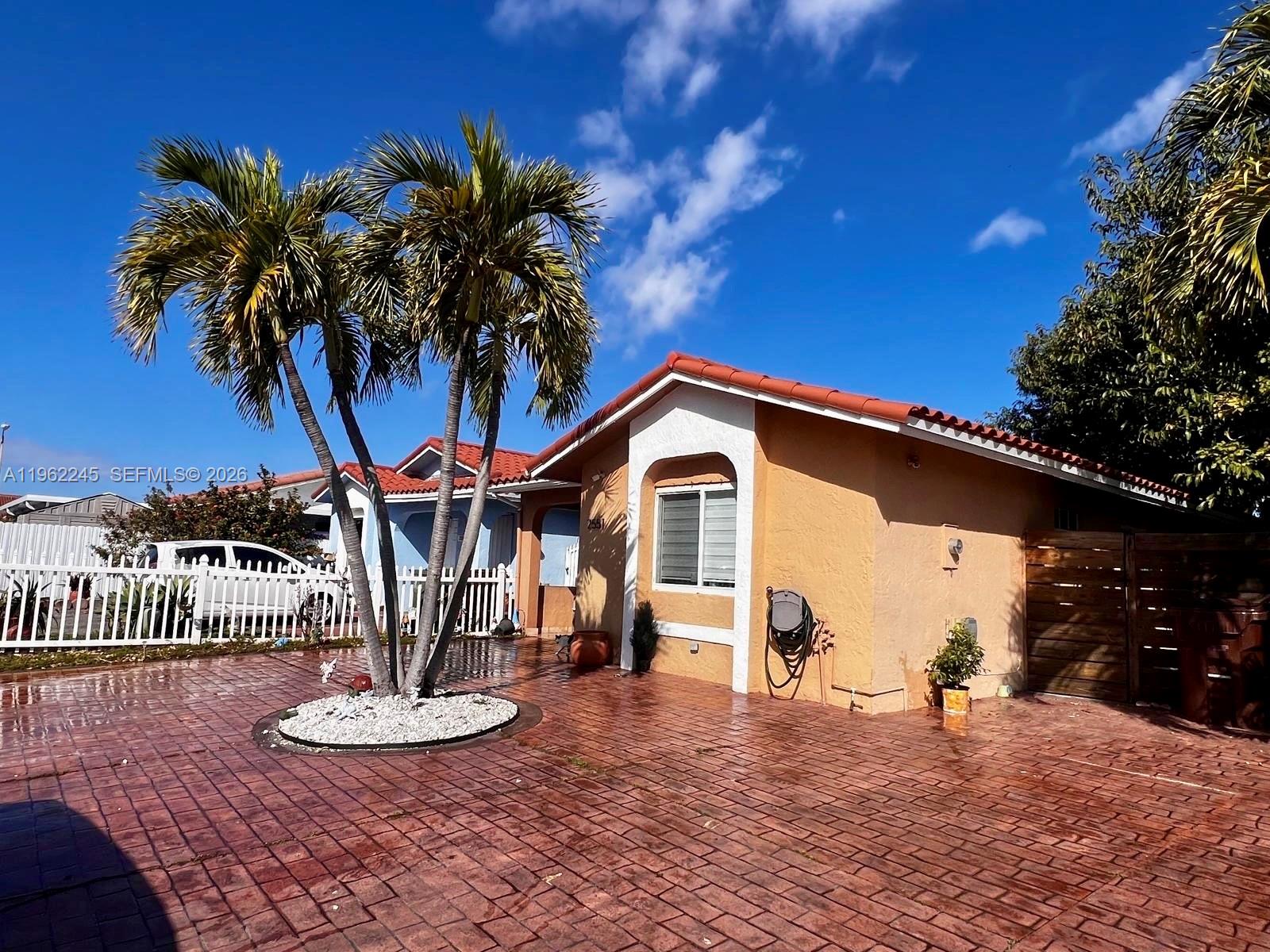 2551 West 64th Place Hialeah, FL 33016 - Photo 20 of 20 a outdoor space with furniture and a fire pit