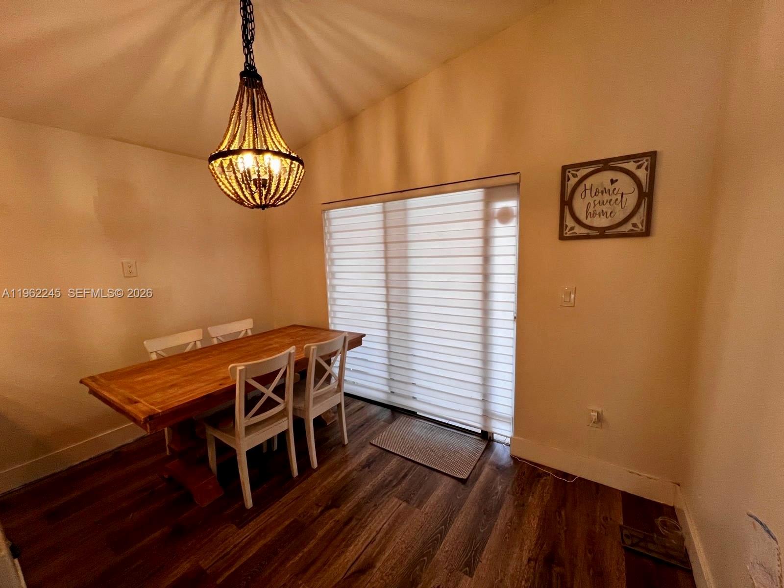 2551 West 64th Place Hialeah, FL 33016 - Photo 8 of 20 a view of a livingroom with furniture and chandelier