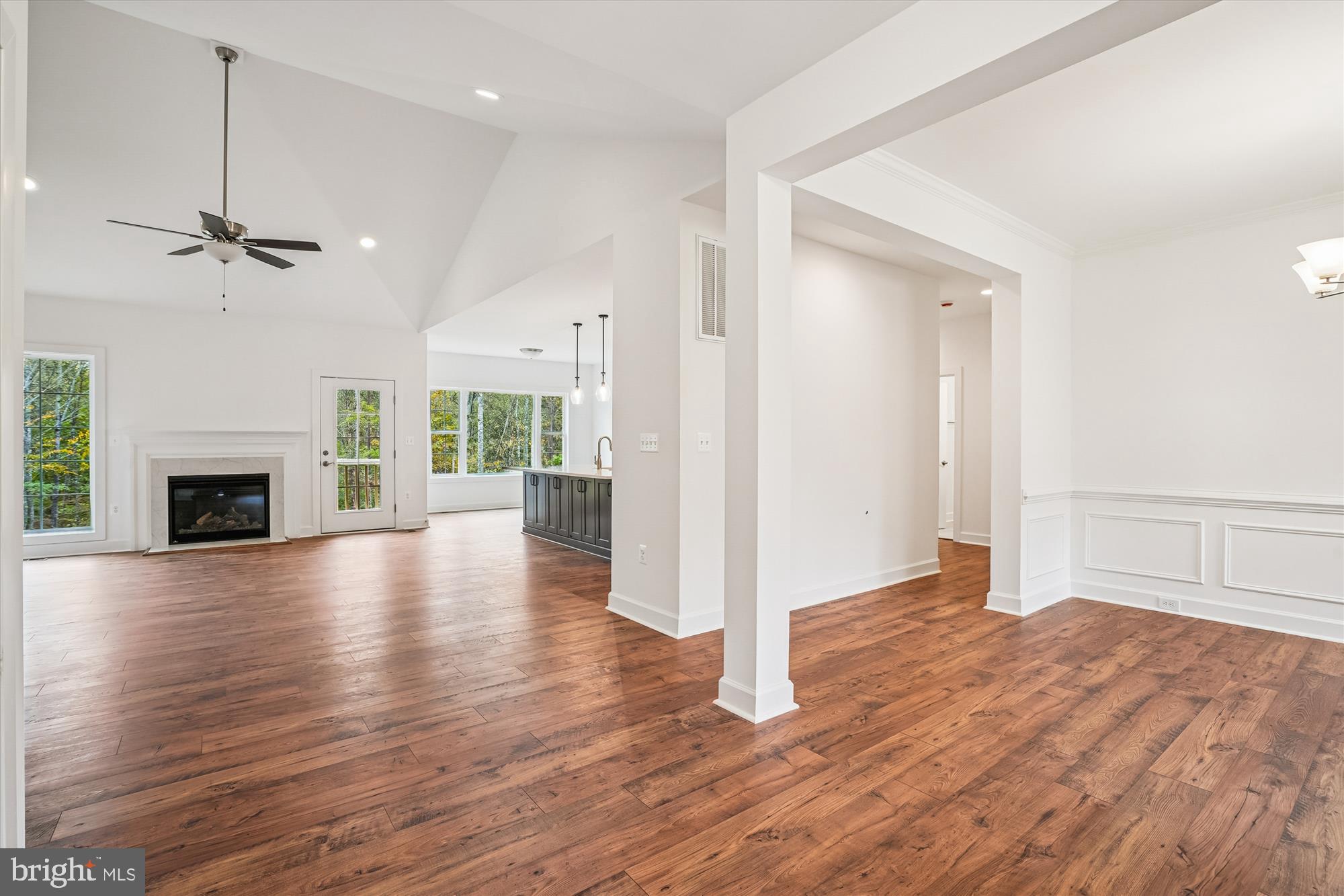15017 Rillhurst Drive Culpeper, VA 22701 - Photo 12 of 34 an empty room with wooden floor fireplace and windows