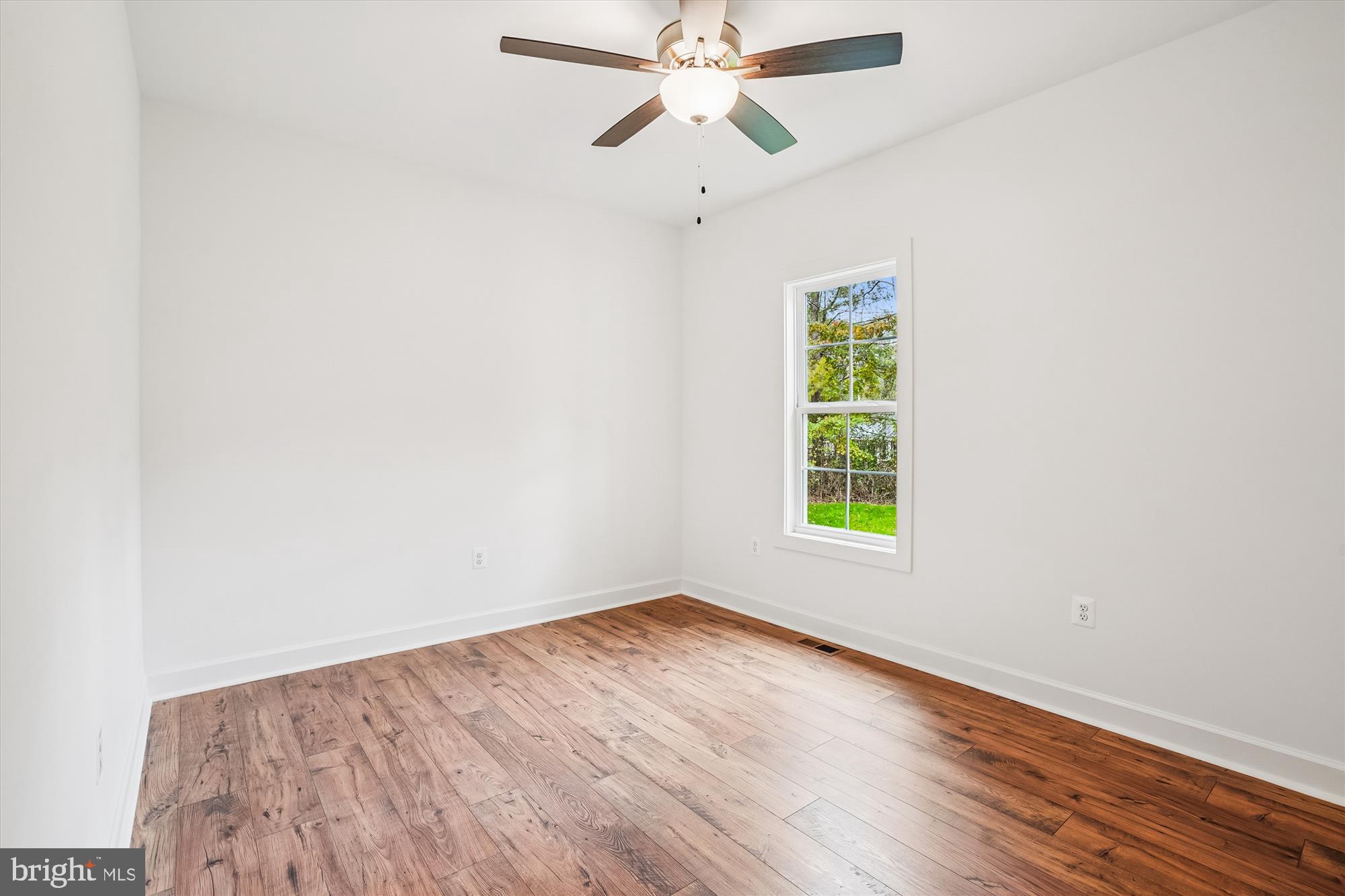 15017 Rillhurst Drive Culpeper, VA 22701 - Photo 21 of 34 wooden floor in an empty room with a window