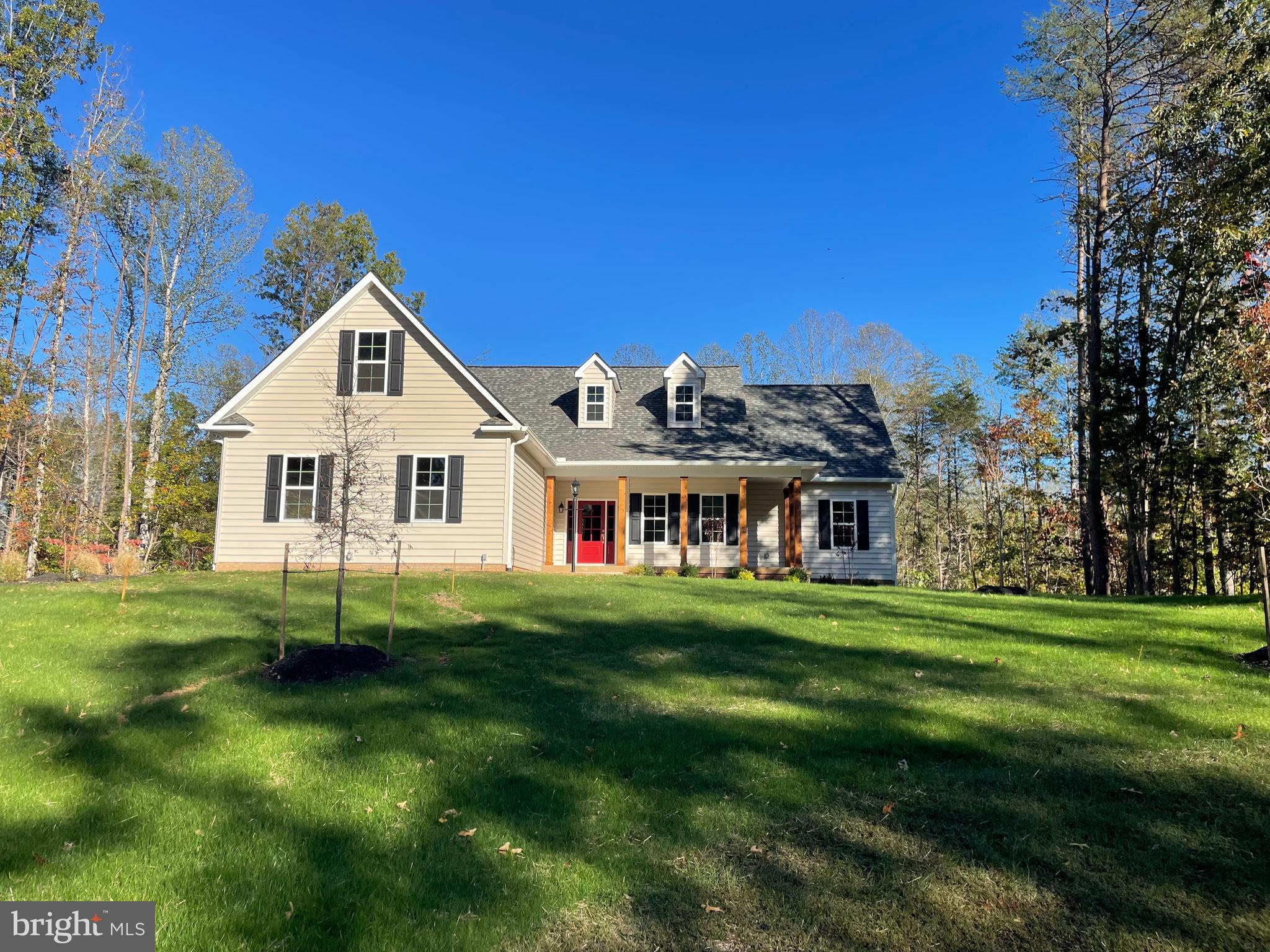 15017 Rillhurst Drive Culpeper, VA 22701 - Photo 28 of 34 a front view of a house with a garden