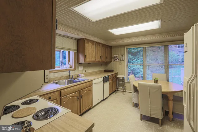 a kitchen that has a sink and a stove