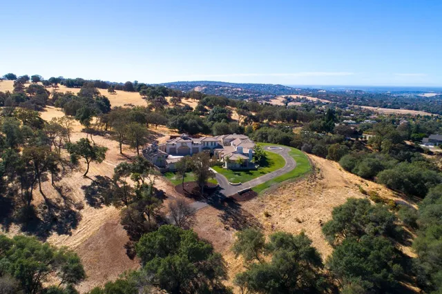 a view of a road with a building in the background