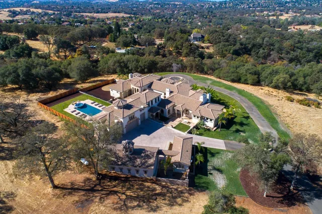 a view of a house with a swimming pool