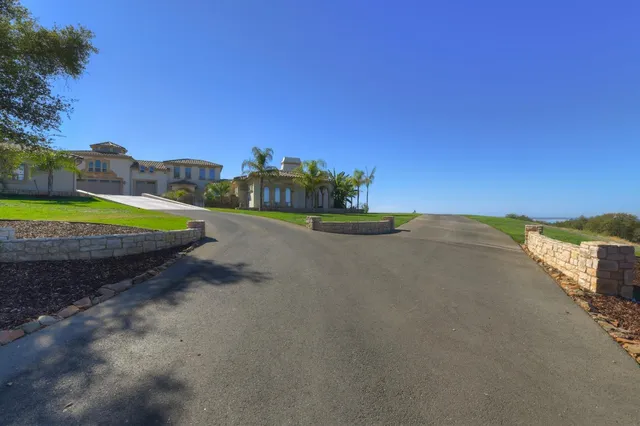 a bathroom with a sink a light fixture and a stove