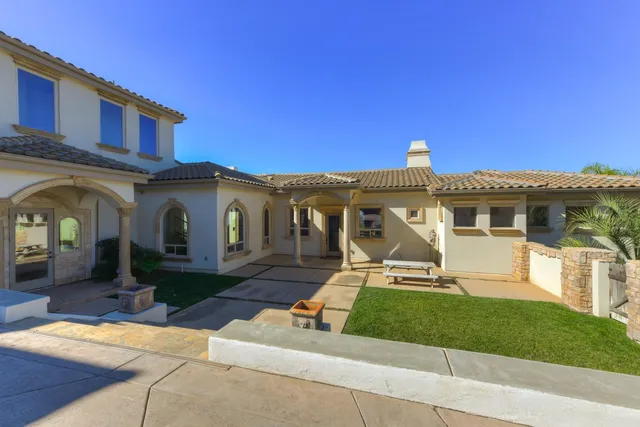 a living room with furniture and a lamp