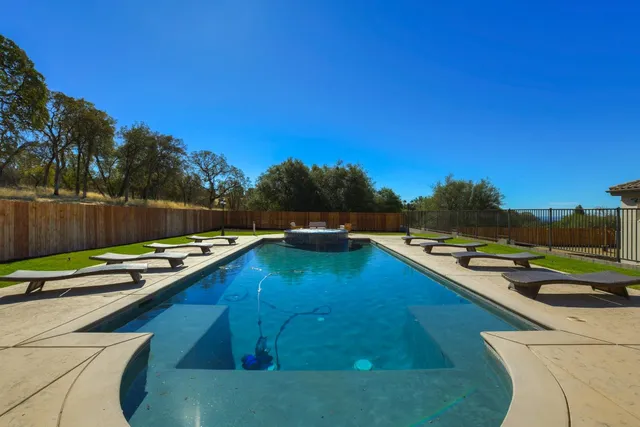 a living room with fireplace furniture and a wooden floor