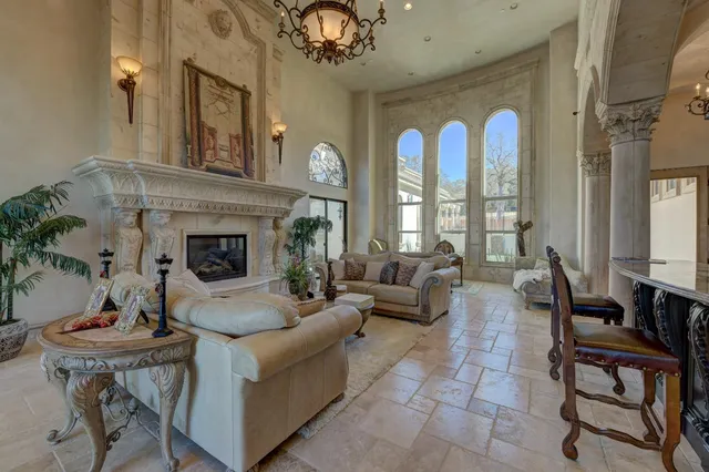 a kitchen with stainless steel appliances granite countertop a sink a stove cabinets and wooden floor