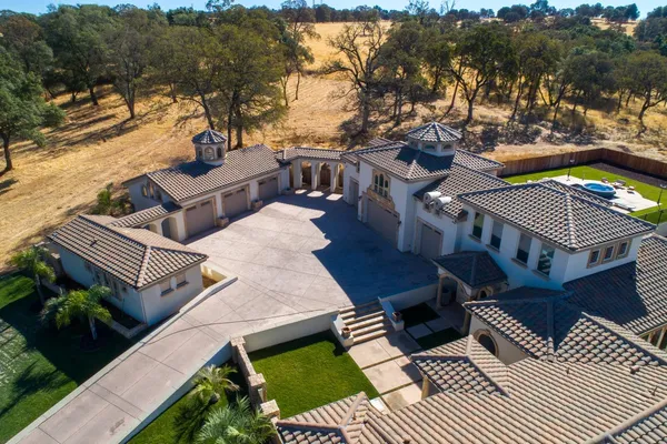 an aerial view of residential house with outdoor space