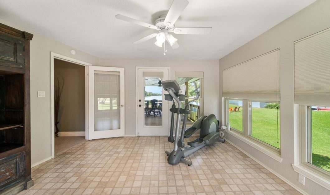 6714 Spray Lane, Unit C699A Rosharon, TX 77583 - Photo 22 of 48 Sunroom/Flex Space has Walls of Windows and Easy Access to the 2nd Floor Covered Deck. This would make a Great Artist Studio, Hobby Room, Gym or Quiet Reading Room. How would you use this space?