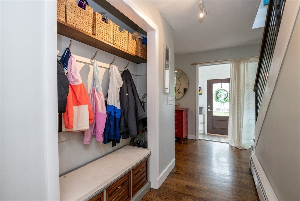 35 Central Street Middleton, MA 01949 - Photo 11 of 42 a view of walk in closet with clothes and shoes