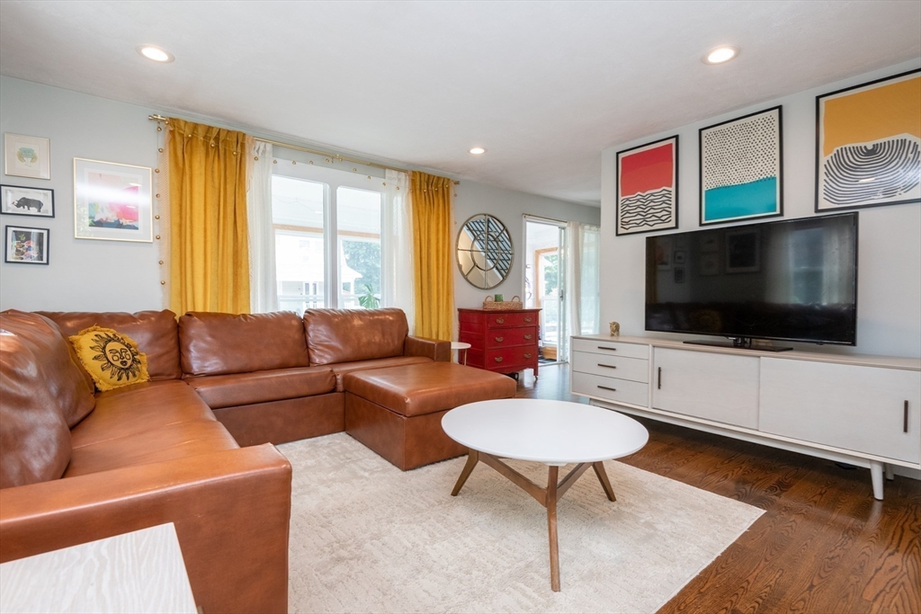 35 Central Street Middleton, MA 01949 - Photo 21 of 42 a living room with furniture and a flat screen tv
