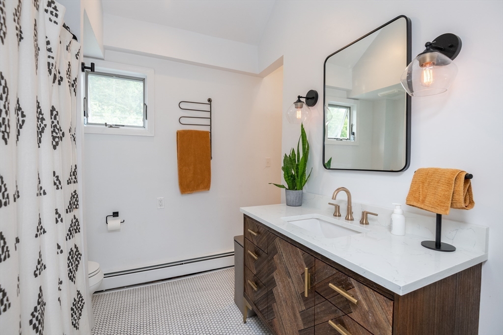 35 Central Street Middleton, MA 01949 - Photo 34 of 42 a bathroom with a sink vanity and mirror