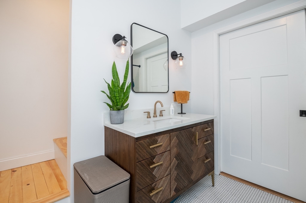 35 Central Street Middleton, MA 01949 - Photo 35 of 42 a bathroom with a sink and a mirror
