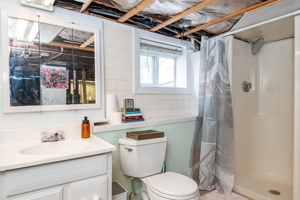 35 Central Street Middleton, MA 01949 - Photo 40 of 42 a bathroom with a sink toilet and shower