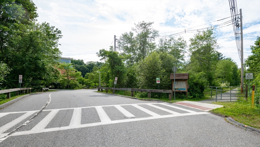 35 Central Street Middleton, MA 01949 - Photo 42 of 42 a view of a patio with a table and chairs and potted plants