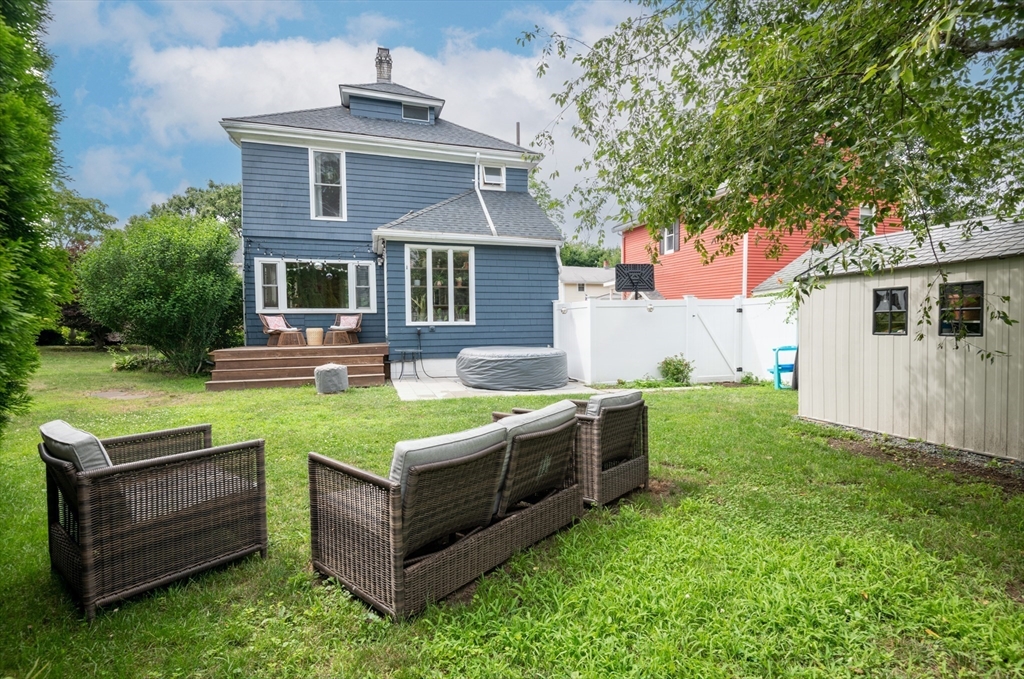 35 Central Street Middleton, MA 01949 - Photo 5 of 42 a front view of house with yard and outdoor seating