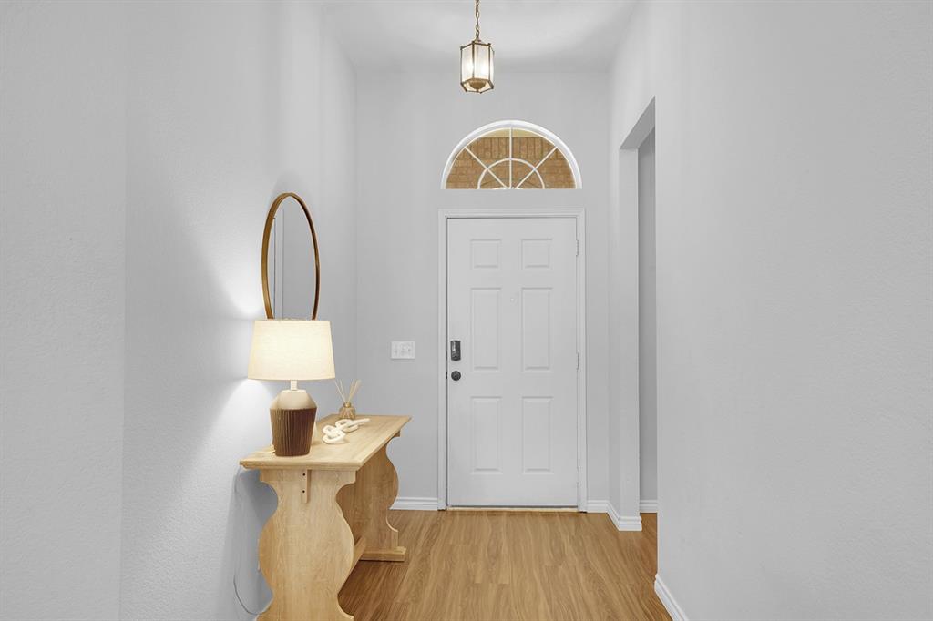 2609 Cowboy Trail Little Elm, TX 75068 - Photo 7 of 34 Entryway featuring light wood-style floors and baseboards