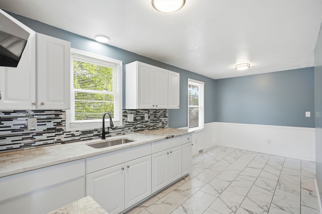 19 Emily Street Springfield, MA 01109 - Photo 11 of 41 a kitchen with a sink and cabinets