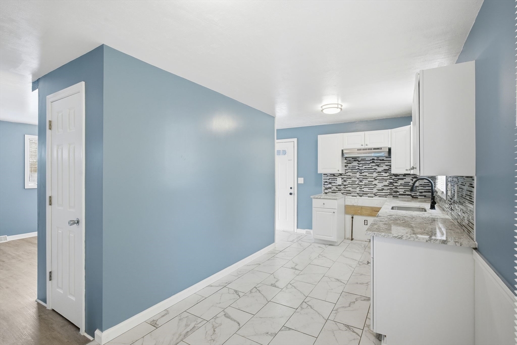 19 Emily Street Springfield, MA 01109 - Photo 12 of 41 a bathroom with a sink a toilet and mirror