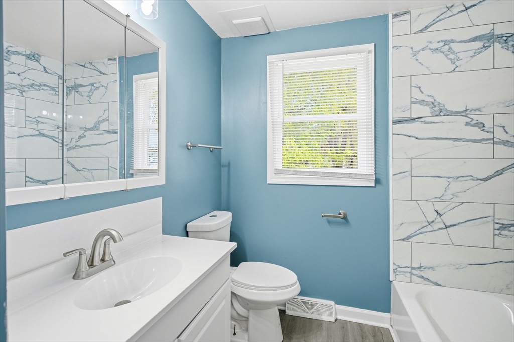 19 Emily Street Springfield, MA 01109 - Photo 14 of 41 a bathroom with a sink a toilet and tub