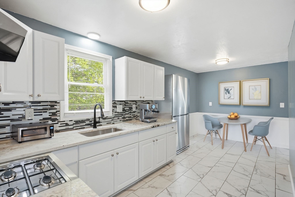 19 Emily Street Springfield, MA 01109 - Photo 2 of 41 a kitchen with a sink and cabinets