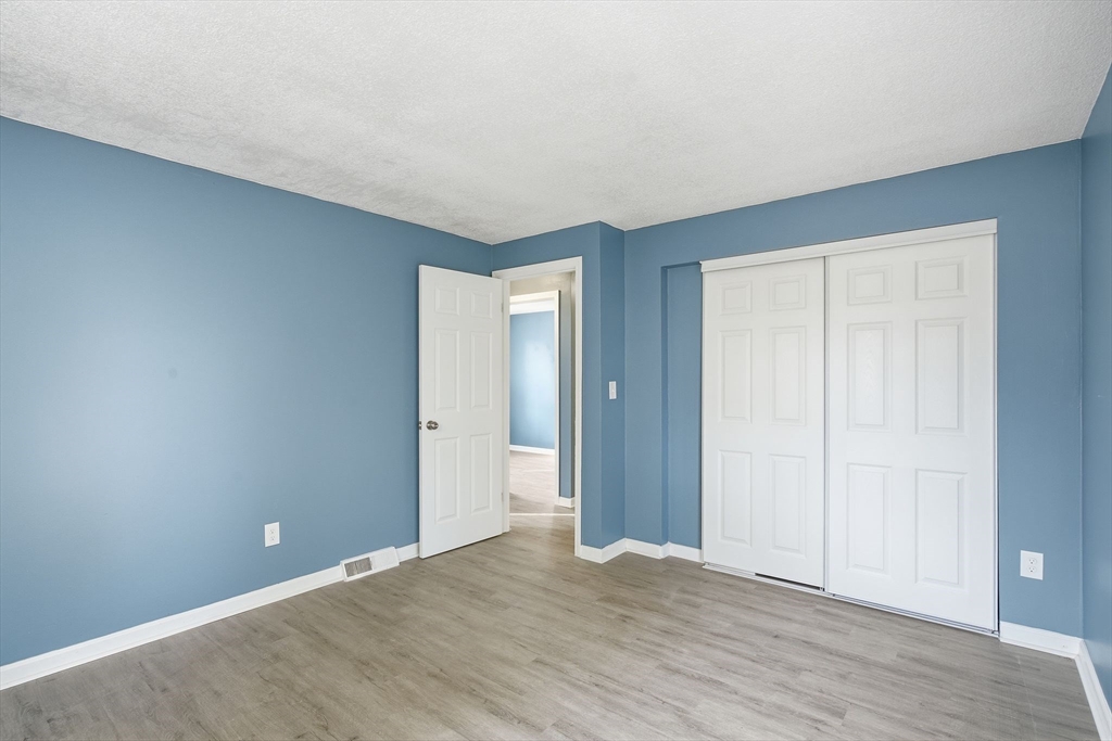 19 Emily Street Springfield, MA 01109 - Photo 21 of 41 a view of an empty room with wooden floor
