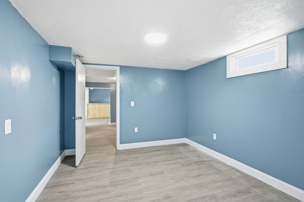 19 Emily Street Springfield, MA 01109 - Photo 29 of 41 wooden floor in an empty room