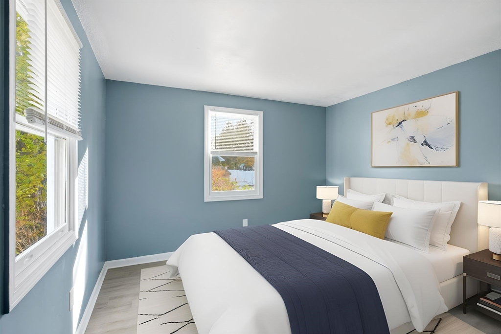 19 Emily Street Springfield, MA 01109 - Photo 3 of 41 a bedroom with a bed and a window