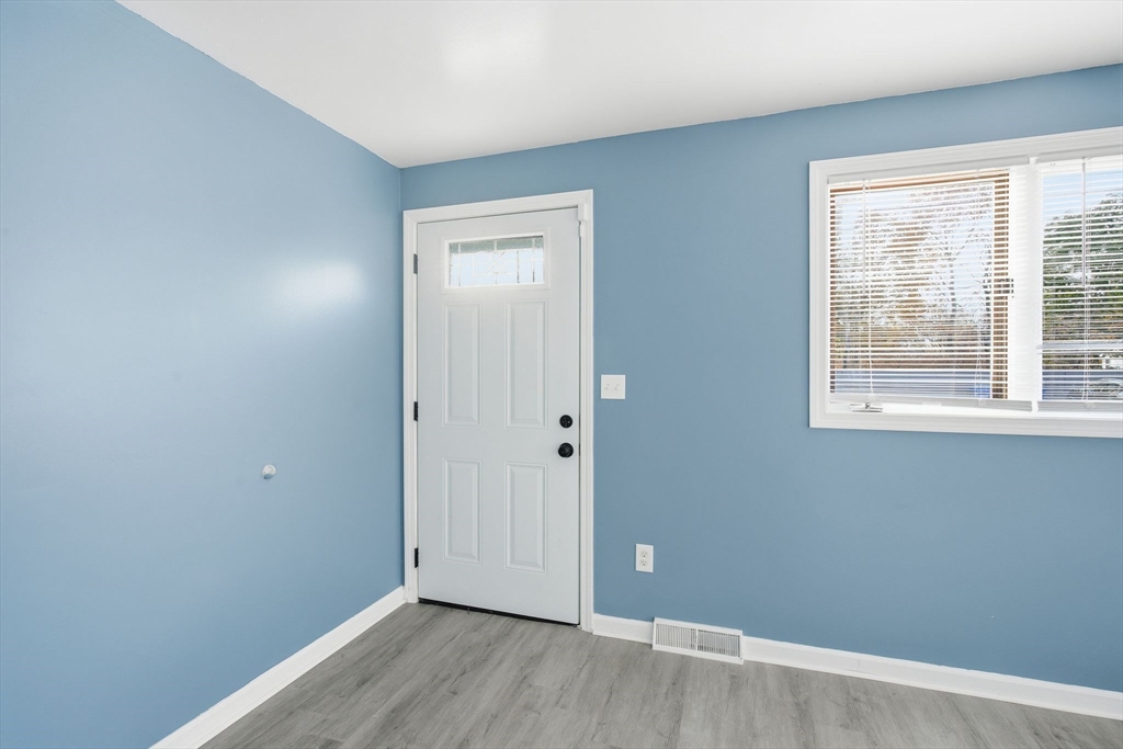 19 Emily Street Springfield, MA 01109 - Photo 7 of 41 a view of an empty room with wooden floor and a window