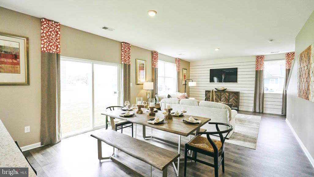 55 Buttercup Circle Elkton, MD 21921 - Photo 12 of 36 a view of a dining room with furniture window and wooden floor