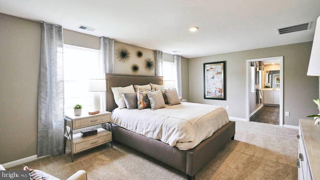 55 Buttercup Circle Elkton, MD 21921 - Photo 23 of 36 a bedroom with a bed table and a window