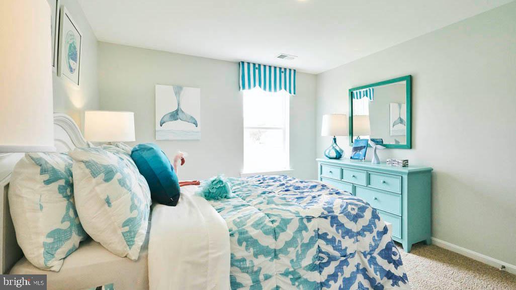 55 Buttercup Circle Elkton, MD 21921 - Photo 31 of 36 a bedroom with a bed mirror and window