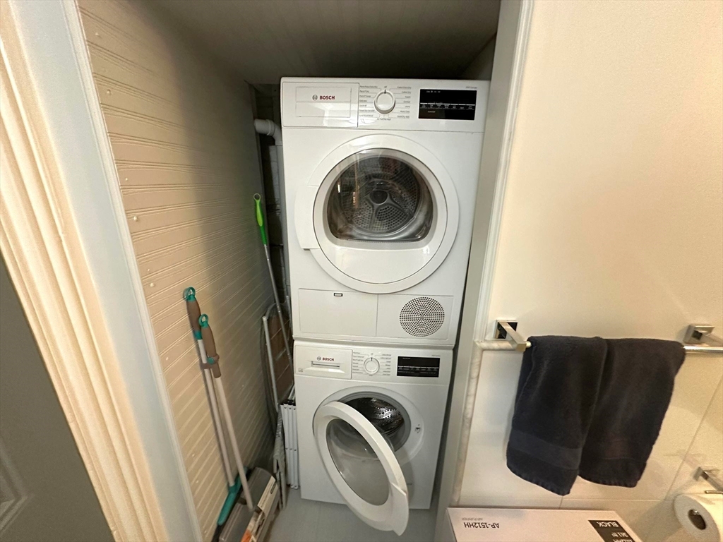 88 Charles Street, Unit 5 Boston, MA 02114 - Photo 12 of 15 a utility room with dryer and washer
