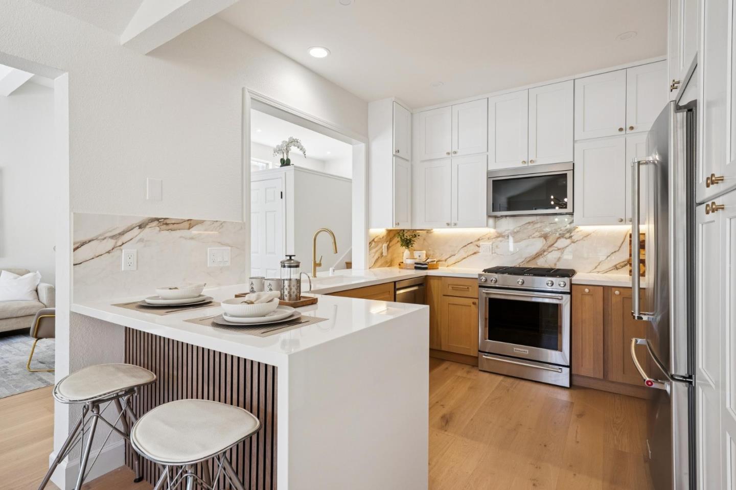 135 Troon Way Half Moon Bay, CA 94019 - Photo 12 of 44 a kitchen with a stove a sink and a refrigerator