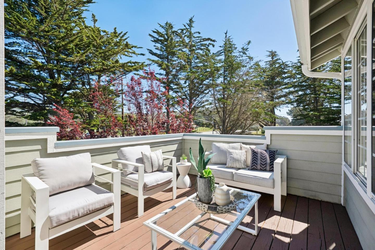 135 Troon Way Half Moon Bay, CA 94019 - Photo 17 of 44 a view of a patio with couches chairs and wooden floor