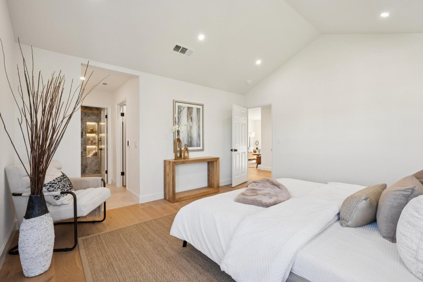 135 Troon Way Half Moon Bay, CA 94019 - Photo 19 of 44 a bedroom with a bed and wooden floor